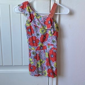 Child’s 6x romper with flower pattern and sparkly strap and pockets.